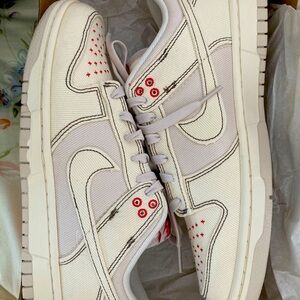 Nike Dunks Low Retro SE Ivory with red stitches. New in original box.